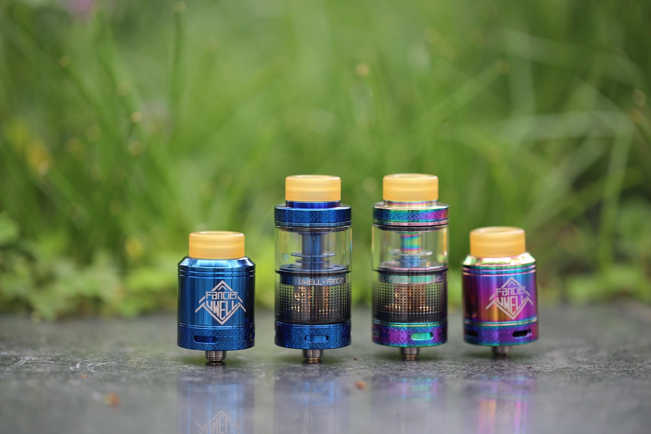 Rows of e-liquid bottles in assorted fruit and mint flavors on shelves